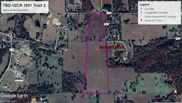 an aerial view of ocean with residential house and outdoor space