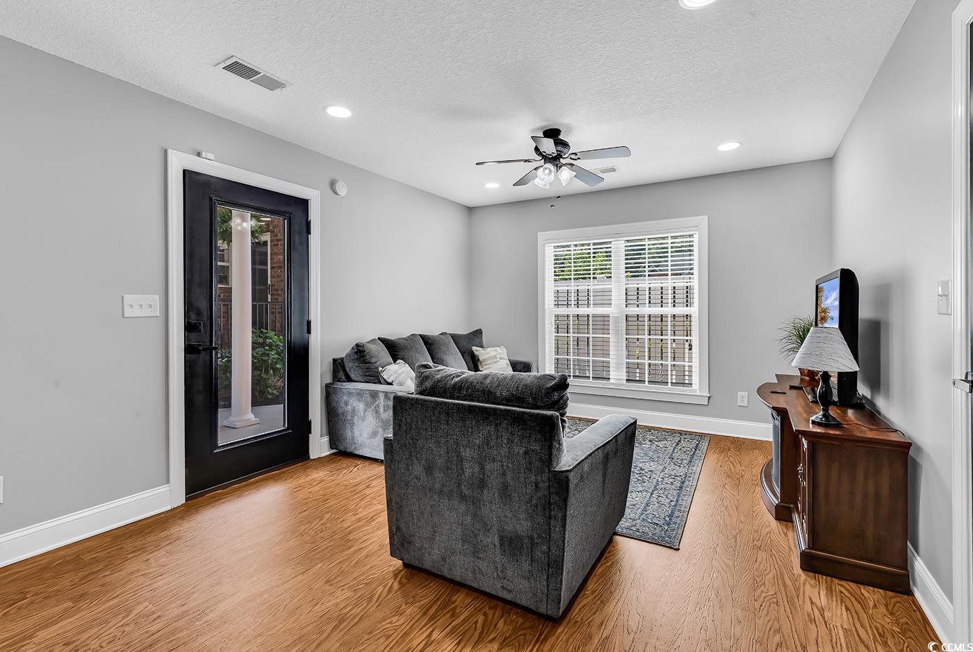 2441 Hunters Trail Myrtle Beach, SC 29588 - Photo 27 of 40 Living room featuring wood finished floors, a ceil