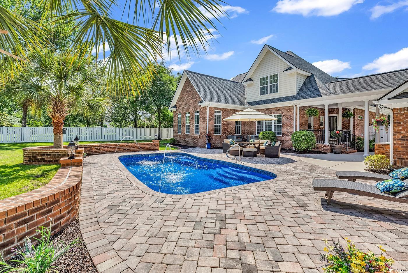 2441 Hunters Trail Myrtle Beach, SC 29588 - Photo 33 of 40 View of pool with a fenced backyard, a patio, and