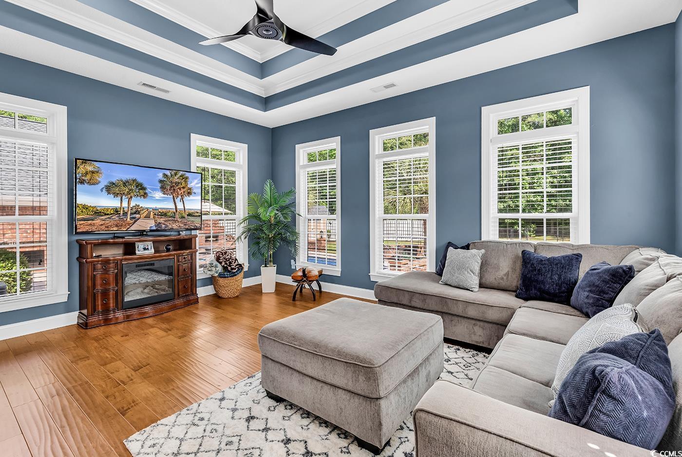 2441 Hunters Trail Myrtle Beach, SC 29588 - Photo 6 of 40 Living room featuring baseboards, ceiling fan, orn