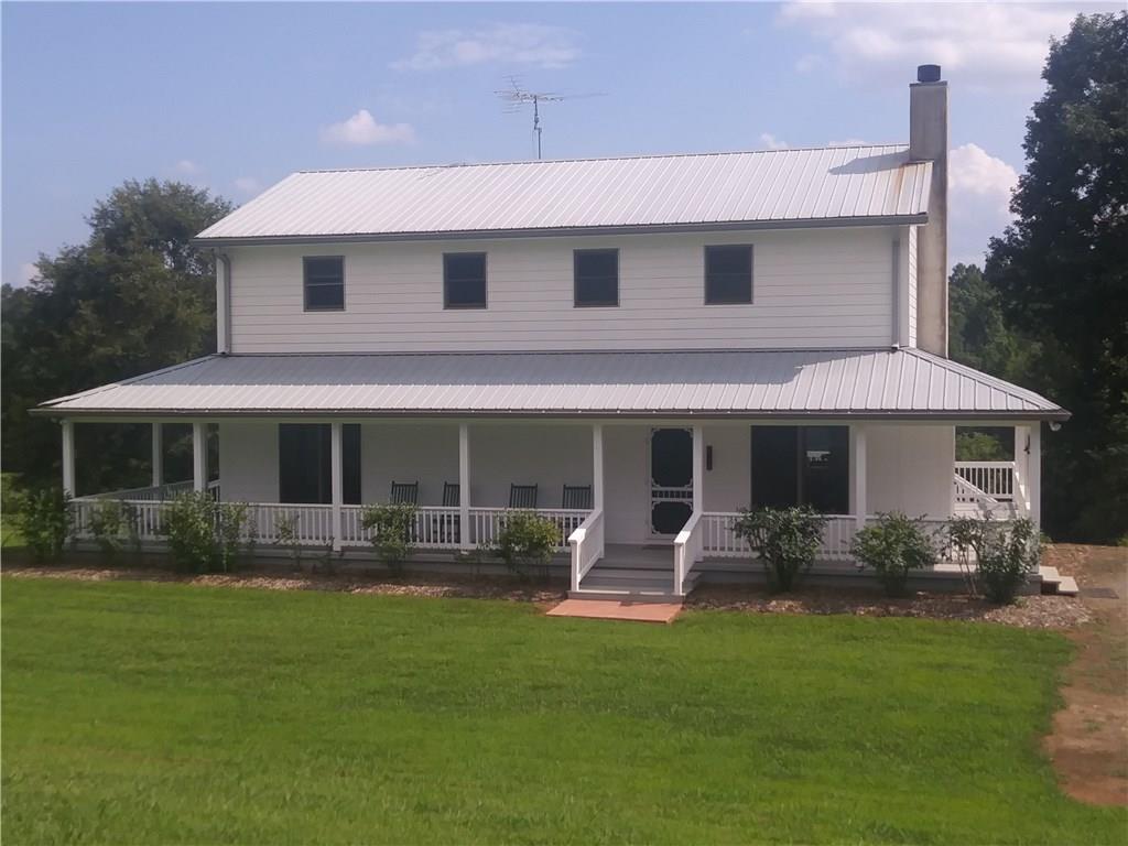 8801 Mull Road Vale, NC 28168 - Photo 1 of 36 a front view of a house with garden