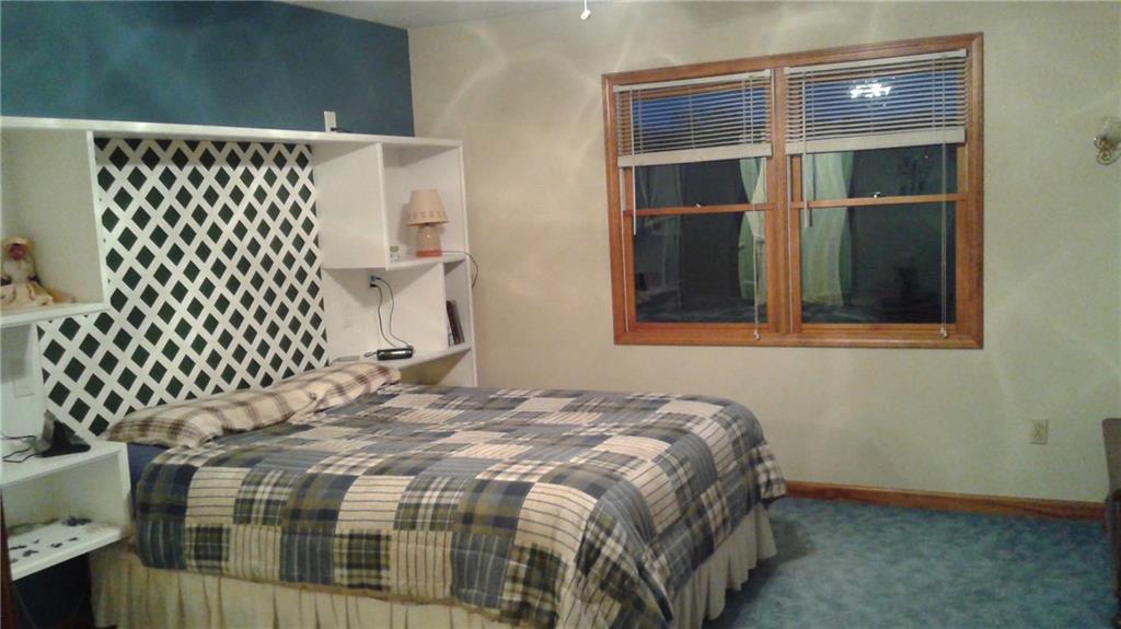 8801 Mull Road Vale, NC 28168 - Photo 12 of 36 a bedroom with a bed and a window