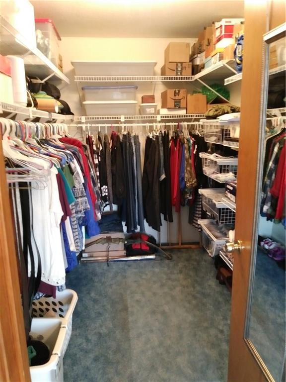 8801 Mull Road Vale, NC 28168 - Photo 13 of 36 a view of walk in closet with clothes