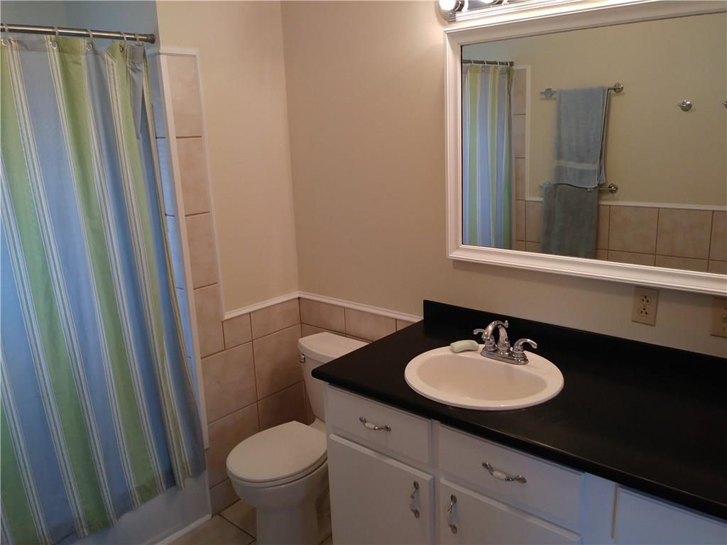 8801 Mull Road Vale, NC 28168 - Photo 14 of 36 a bathroom with a sink toilet and a mirror