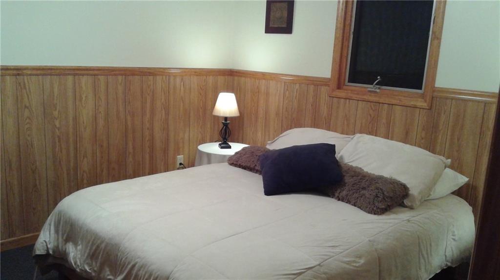 8801 Mull Road Vale, NC 28168 - Photo 19 of 36 a large bed in a bedroom next to a cabinet