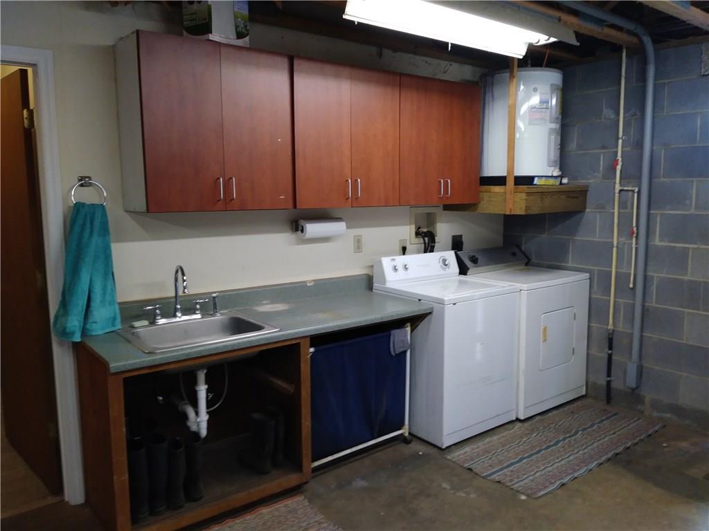 8801 Mull Road Vale, NC 28168 - Photo 22 of 36 a utility room with a sink washer and dryer