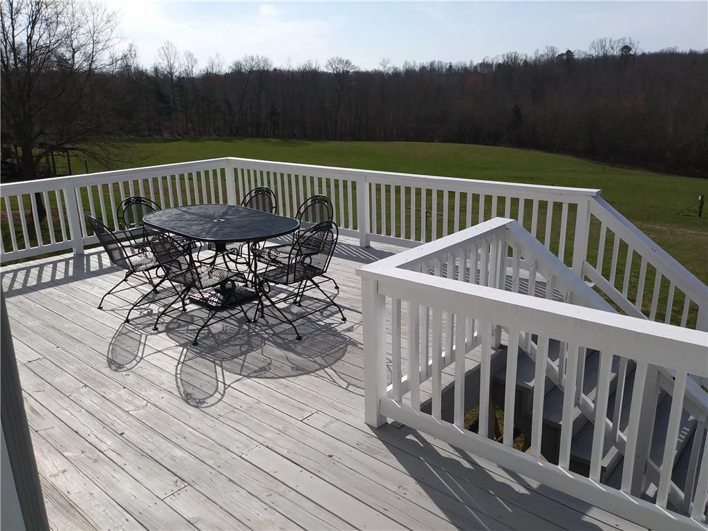 8801 Mull Road Vale, NC 28168 - Photo 24 of 36 a view of balcony with wooden floor and outdoor seating