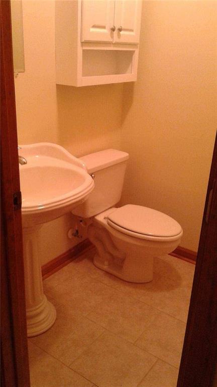 8801 Mull Road Vale, NC 28168 - Photo 9 of 36 a bathroom with a toilet and a sink