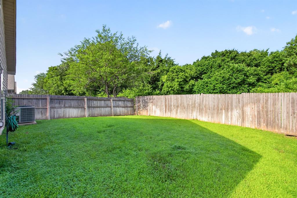 5069 Britton Ridge Lane Fort Worth, TX 76179 - Photo 29 of 32 Another view showing the tree line and green space behind. SO private and peaceful.