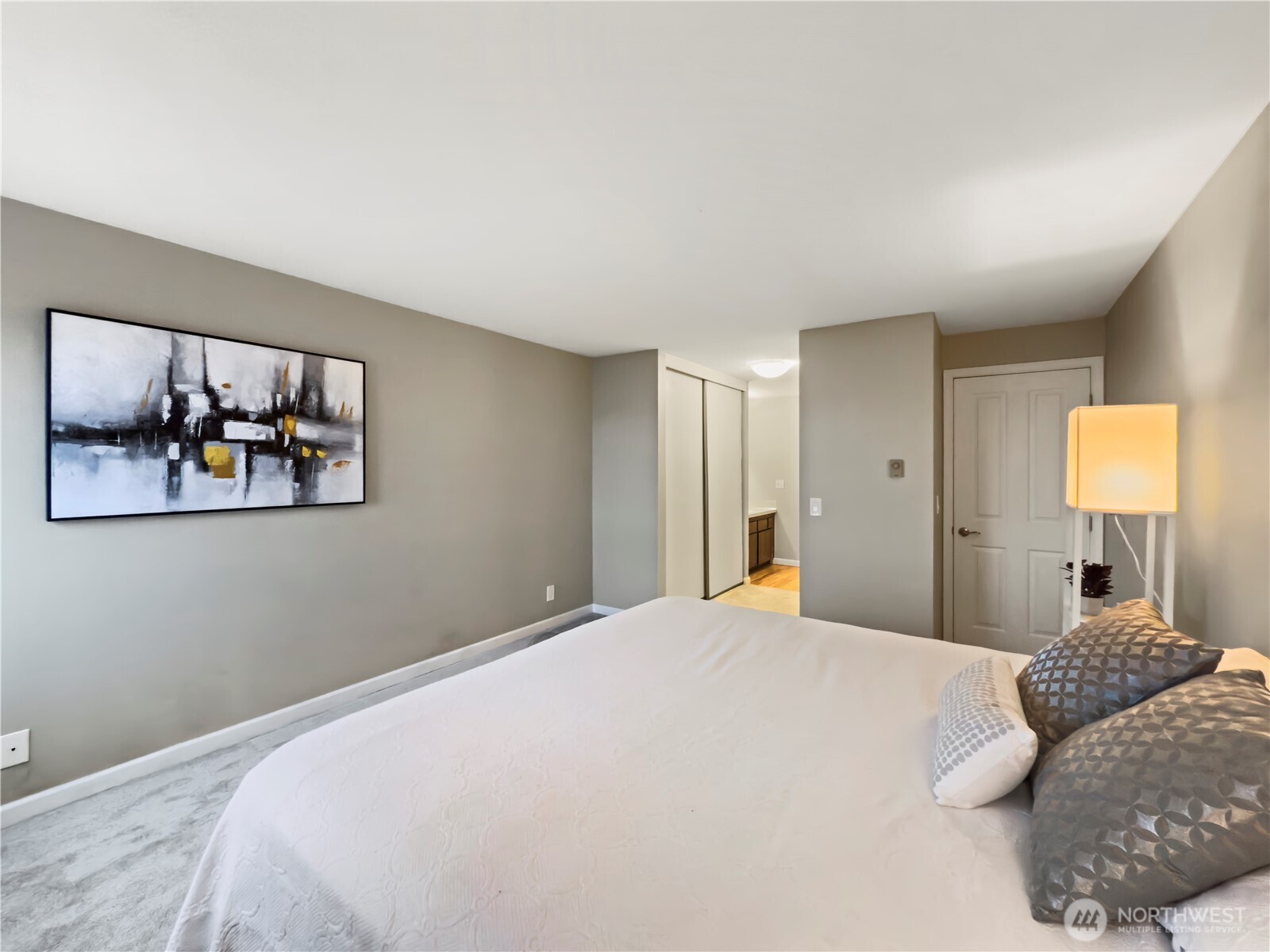 444 South State Street, Unit 307 Bellingham, WA 98225 - Photo 15 of 34 a bedroom with a large bed and a window