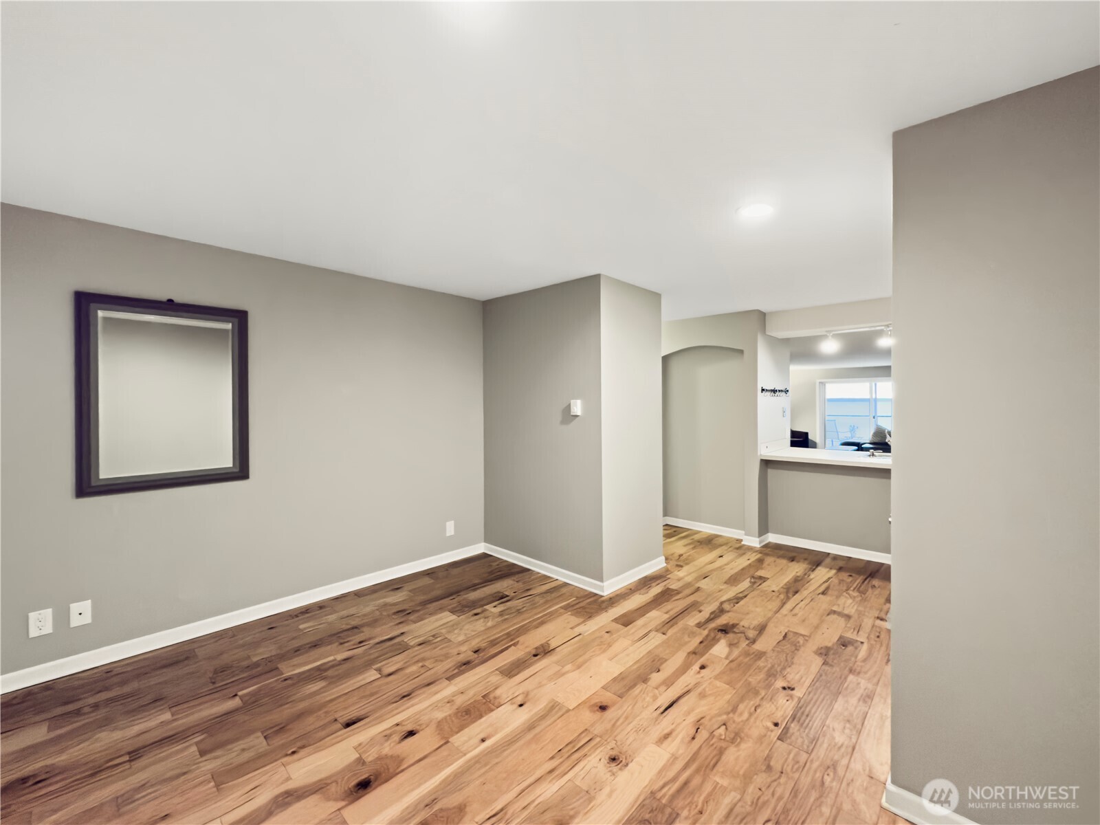 444 South State Street, Unit 307 Bellingham, WA 98225 - Photo 20 of 34 a view of a big room with wooden floor and a kitchen