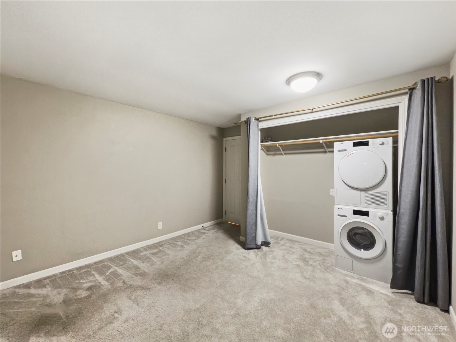 444 South State Street, Unit 307 Bellingham, WA 98225 - Photo 23 of 34 a view of a storage & utility room with a washer and dryer