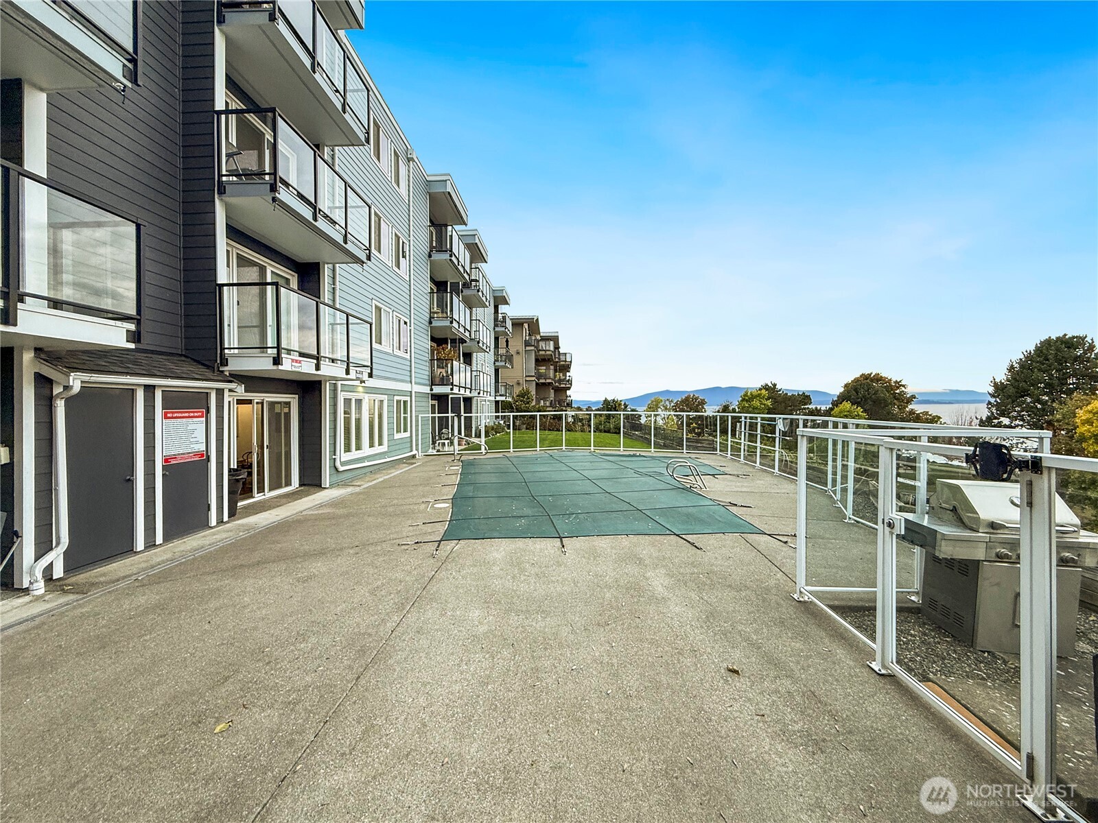 444 South State Street, Unit 307 Bellingham, WA 98225 - Photo 27 of 34 a view of a house with a swimming pool