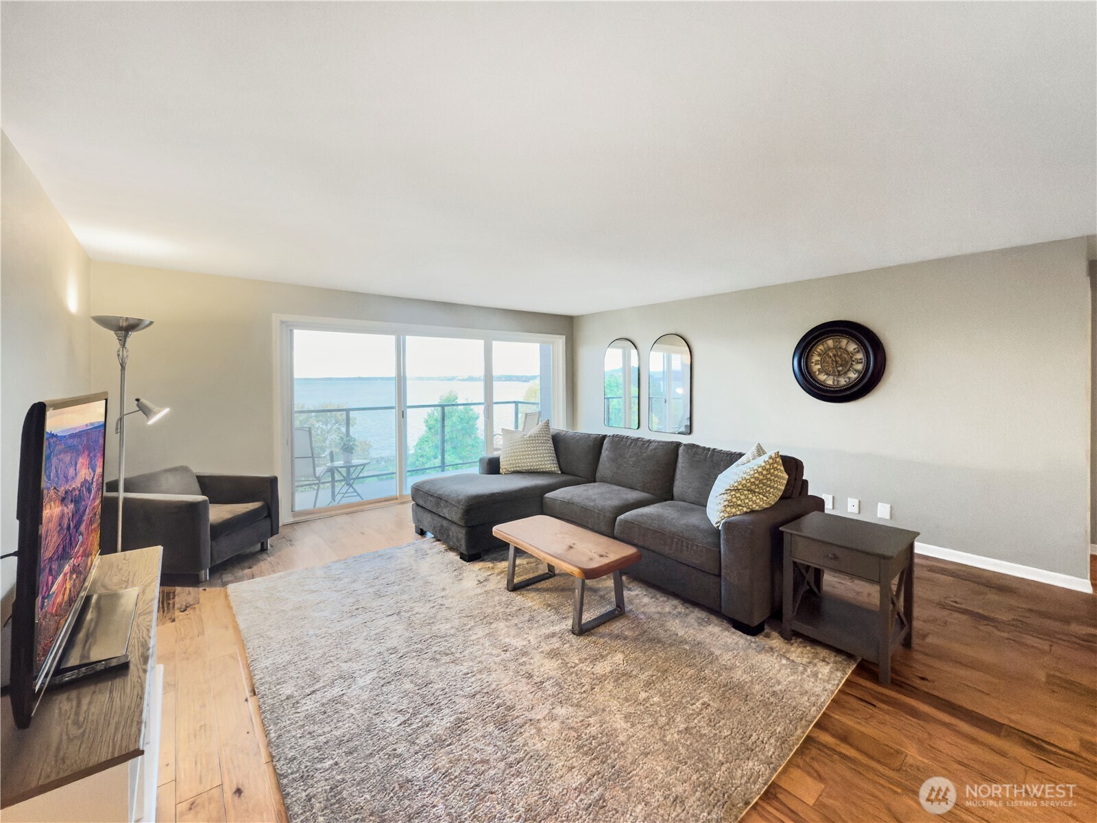 444 South State Street, Unit 307 Bellingham, WA 98225 - Photo 4 of 34 a living room with furniture a fireplace and a large window