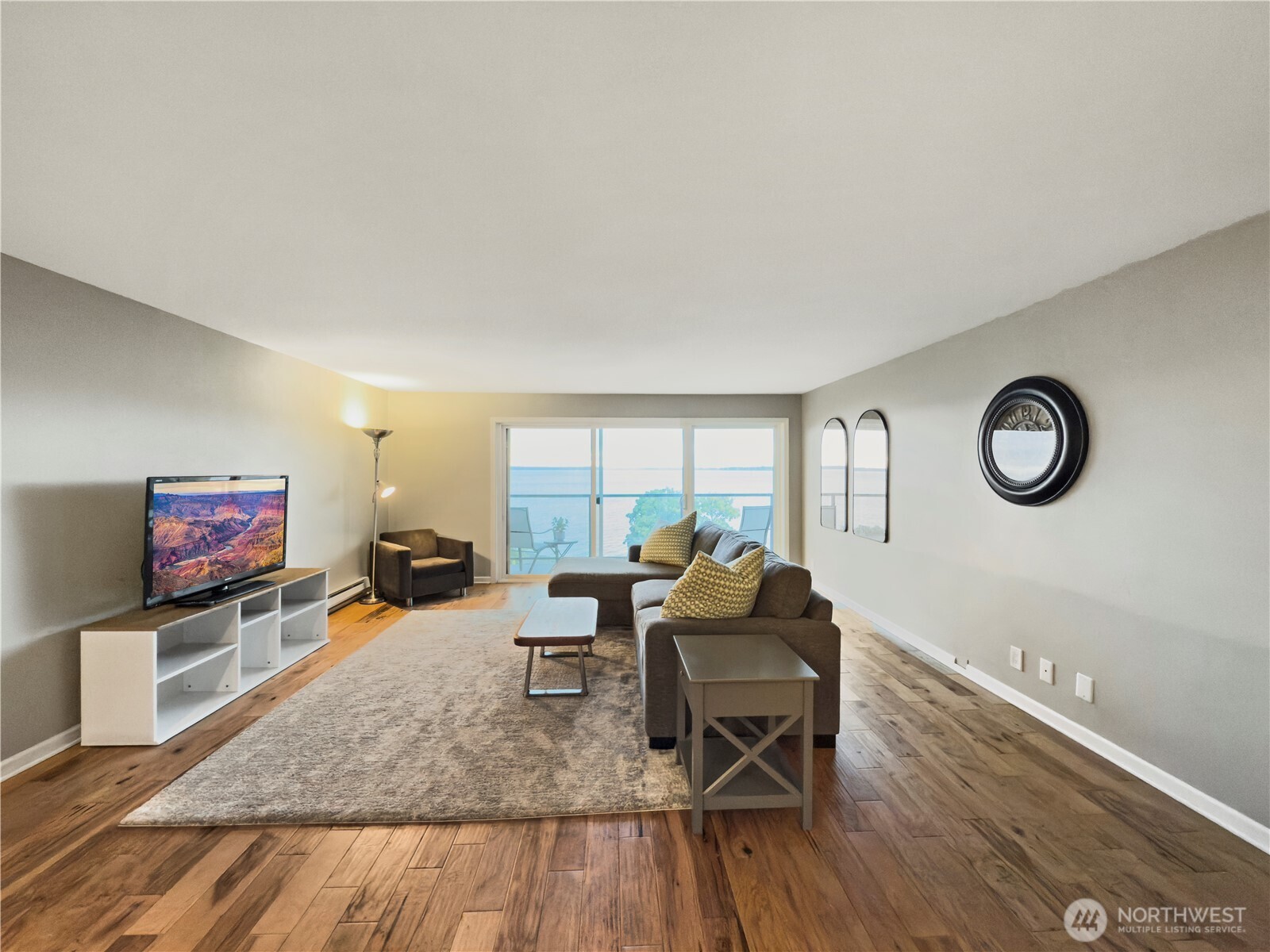 444 South State Street, Unit 307 Bellingham, WA 98225 - Photo 6 of 34 a living room with furniture and a flat screen tv