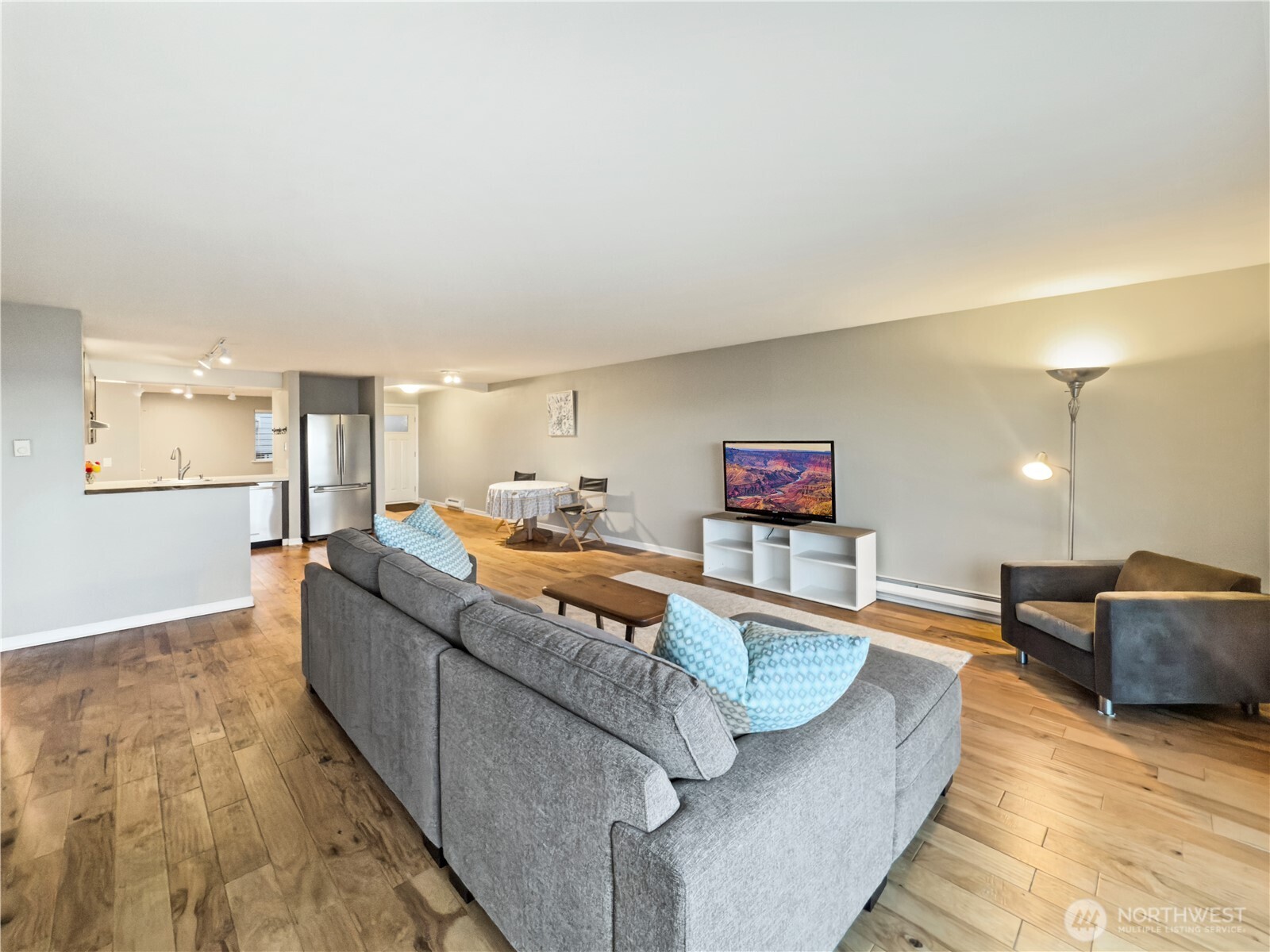 444 South State Street, Unit 307 Bellingham, WA 98225 - Photo 8 of 34 a living room with furniture and a flat screen tv