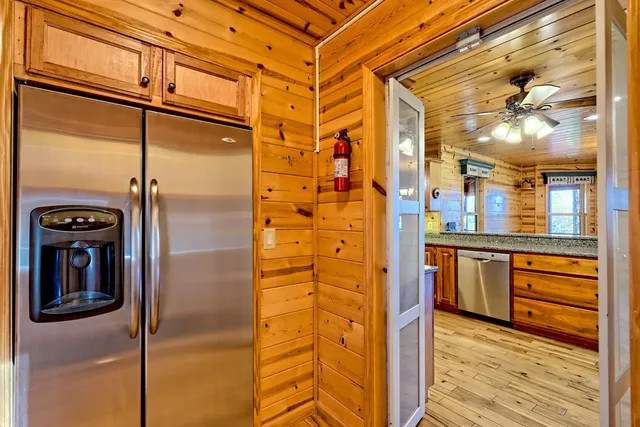 a large bathroom with a glass door shower and sink
