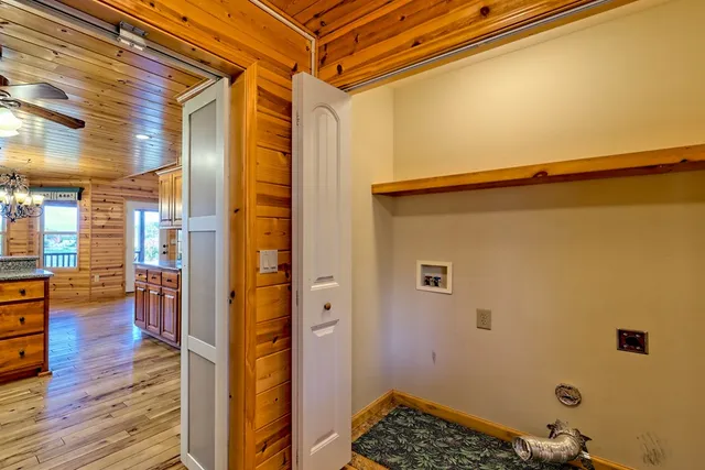 a large bathroom with double vanity and mirrors