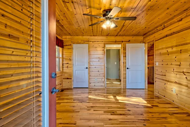 a room with bed and a window