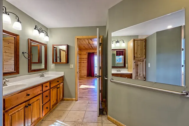 a bathroom with a sink and a mirror