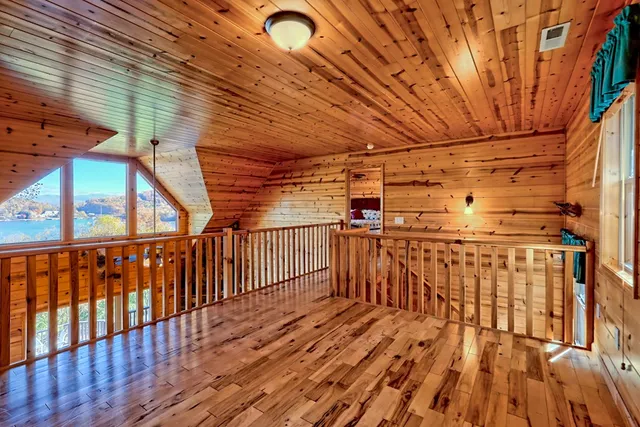 a view of outdoor space with wooden floor and staircase