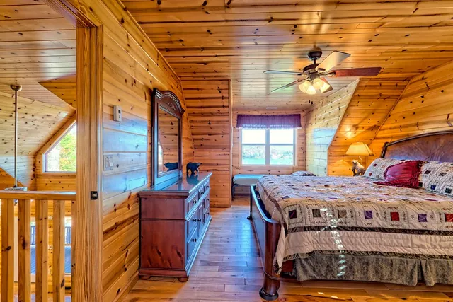 an aerial view of a houses with a lake view