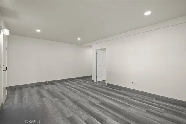 a view of room with wooden floor