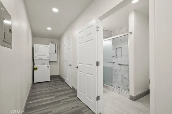 a bathroom with a shower a toilet and sink