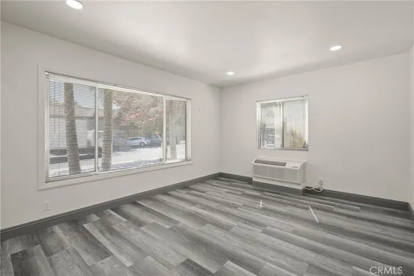 a view of an empty room with a window