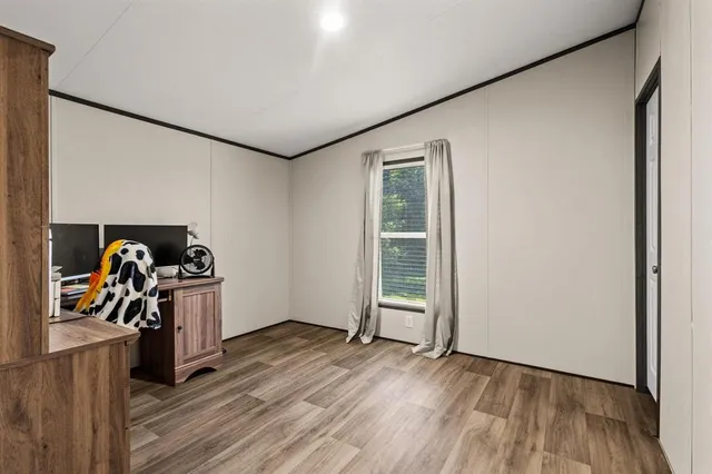 a view of a livingroom with wooden floor