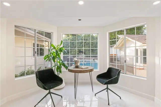 a dining room with furniture and window