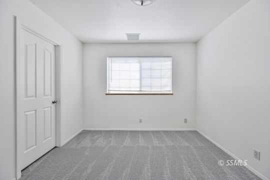 1213 Alysa Court Ridgecrest, CA 93555 - Photo 17 of 34 an empty room with a window