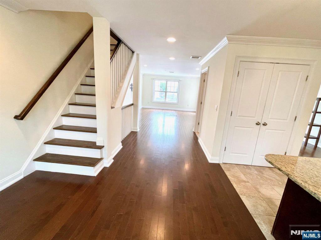 1625 Paterson Plank Road, Unit 18 Secaucus, NJ 07094 - Photo 12 of 23 a view of a hallway with wooden floor and staircase