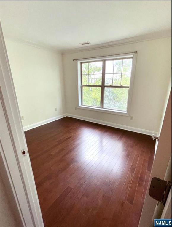 1625 Paterson Plank Road, Unit 18 Secaucus, NJ 07094 - Photo 17 of 23 an empty room with wooden floor and windows