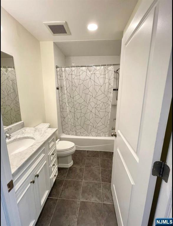 1625 Paterson Plank Road, Unit 18 Secaucus, NJ 07094 - Photo 19 of 23 a bathroom with a granite countertop sink toilet and shower