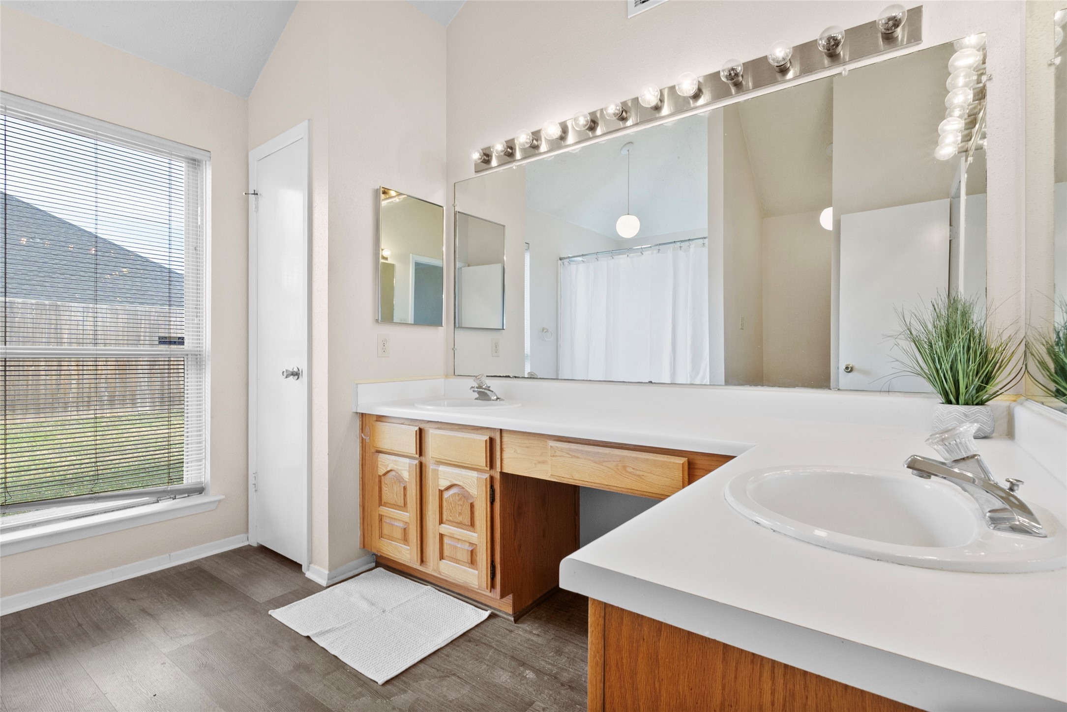 13222 Maplecrest Drive Houston, TX 77041 - Photo 24 of 31 a bathroom with a sink and a mirror
