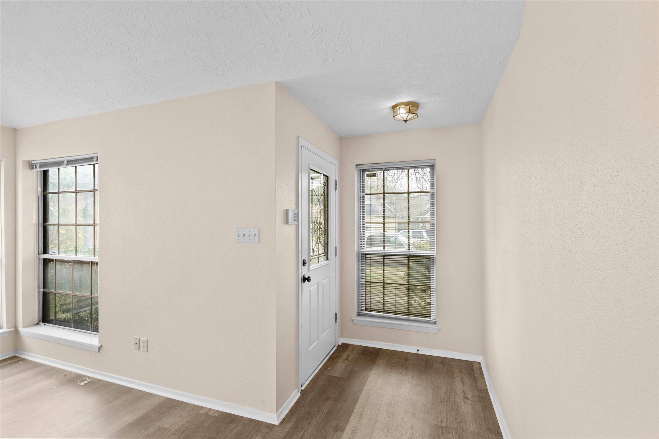 13222 Maplecrest Drive Houston, TX 77041 - Photo 5 of 31 wooden floor in an empty room with a window