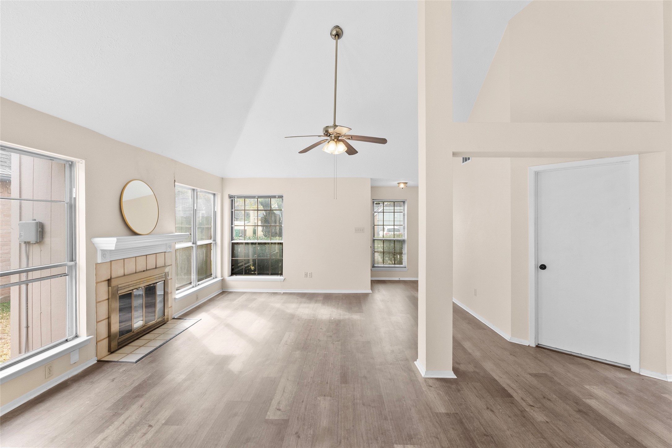 13222 Maplecrest Drive Houston, TX 77041 - Photo 7 of 31 a view of a livingroom with wooden floor and a fireplace