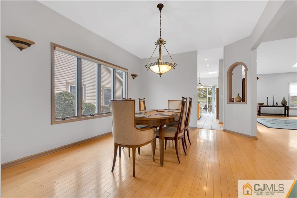 45 Harwood Road Monroe Township, NJ 08831 - Photo 11 of 35 a view of a dining room with furniture window and wooden floor