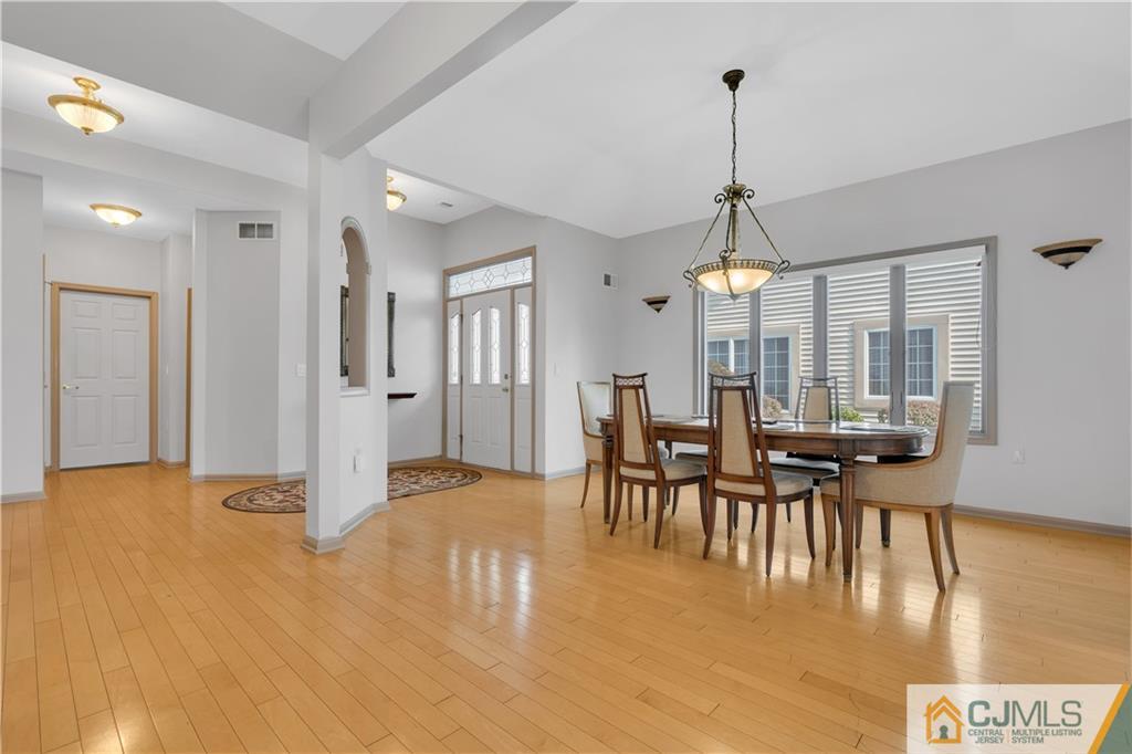 45 Harwood Road Monroe Township, NJ 08831 - Photo 12 of 35 a view of a dining room with furniture window and wooden floor