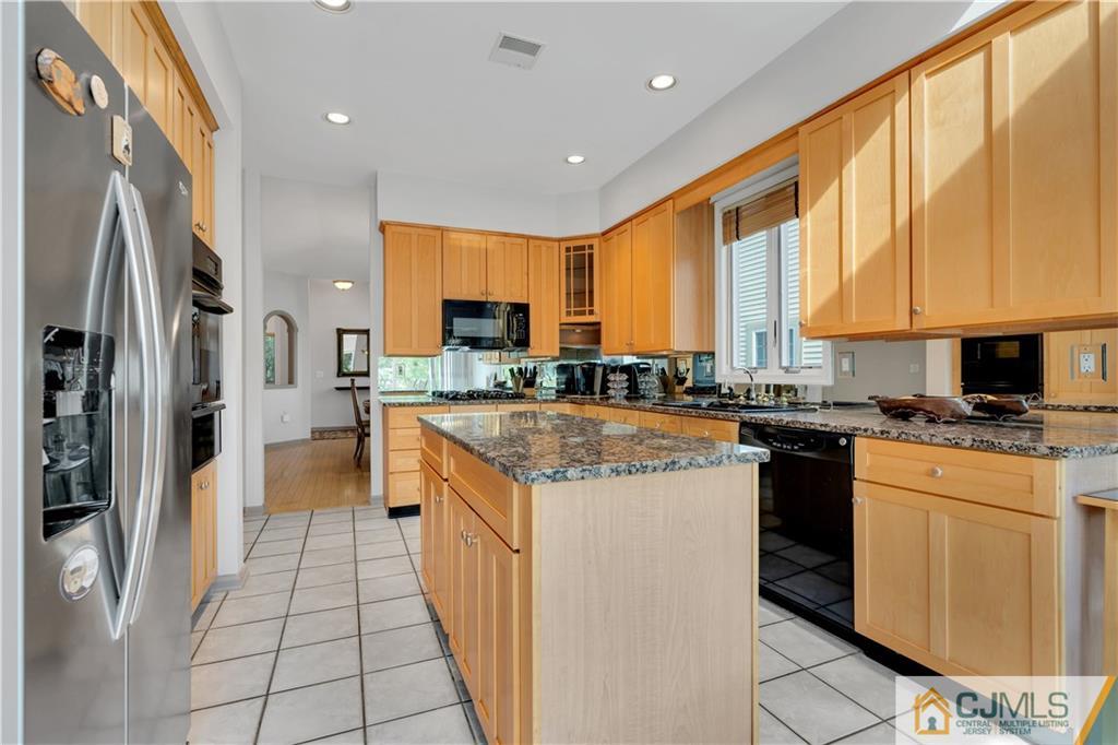 45 Harwood Road Monroe Township, NJ 08831 - Photo 14 of 35 a kitchen with stainless steel appliances granite countertop a refrigerator a stove and a sink