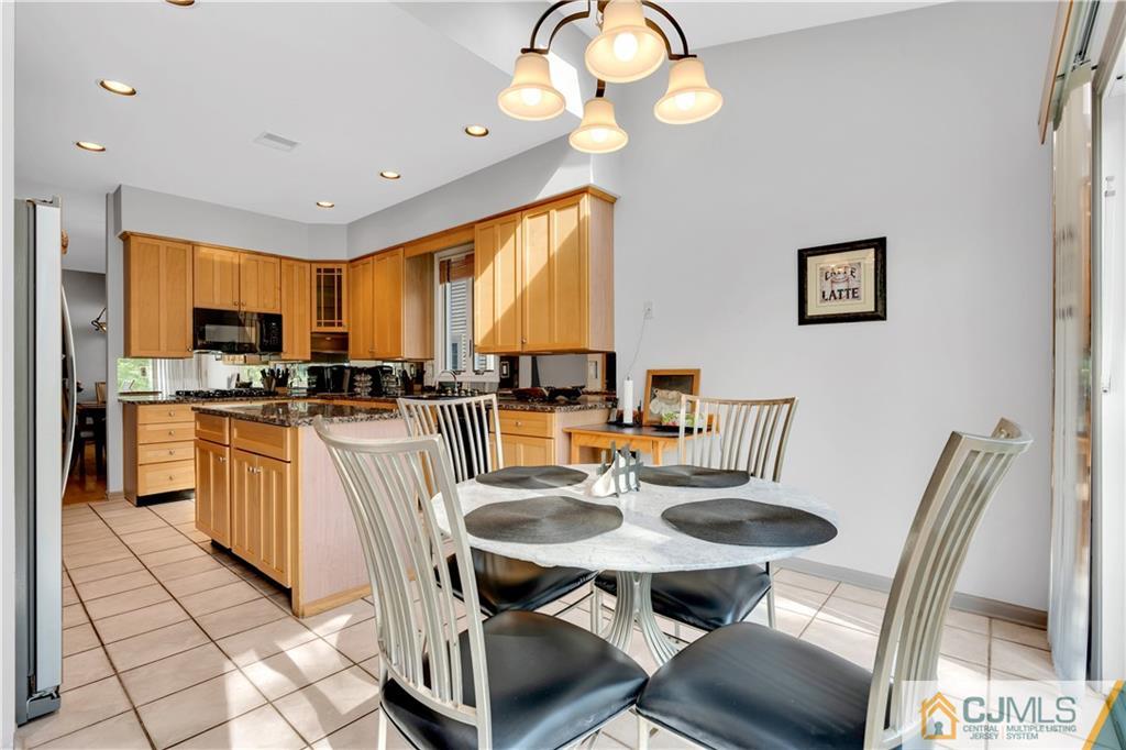 45 Harwood Road Monroe Township, NJ 08831 - Photo 17 of 35 a kitchen with a sink refrigerator and cabinets