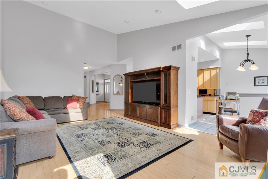 45 Harwood Road Monroe Township, NJ 08831 - Photo 19 of 35 a living room with furniture and a flat screen tv