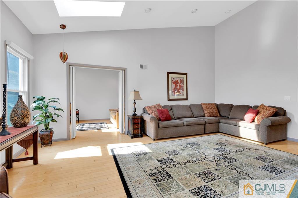 45 Harwood Road Monroe Township, NJ 08831 - Photo 21 of 35 a living room with furniture and a couch