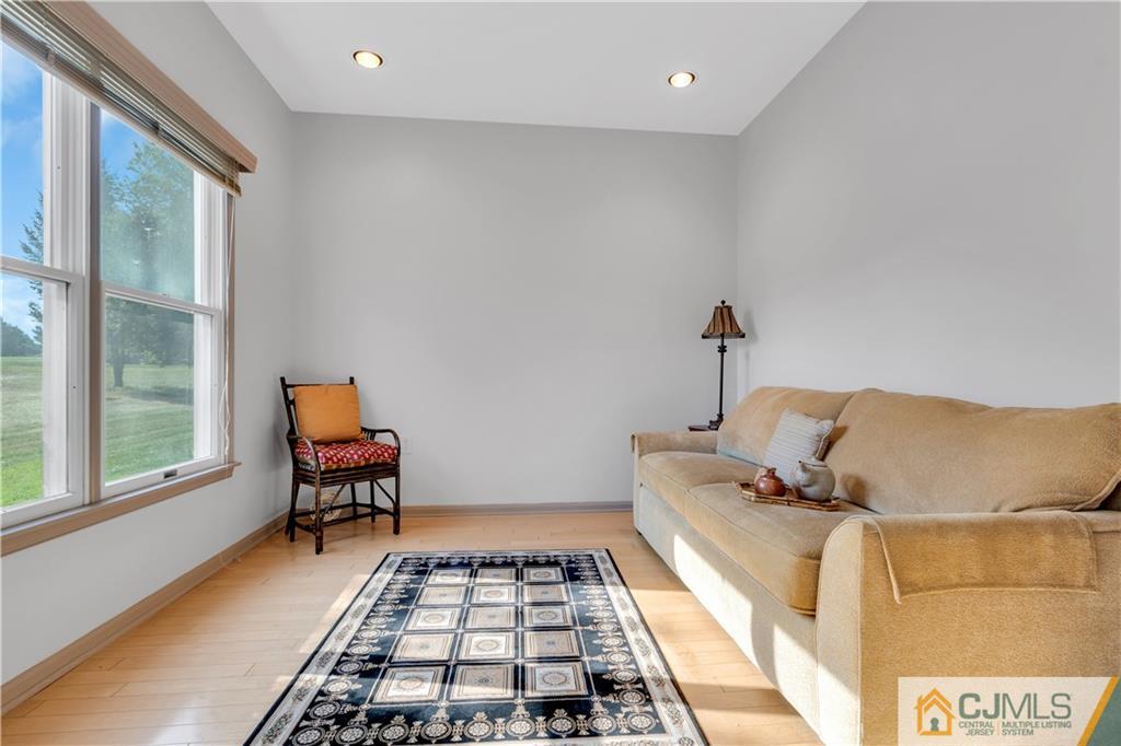 45 Harwood Road Monroe Township, NJ 08831 - Photo 22 of 35 a bed room with a bed and a chair