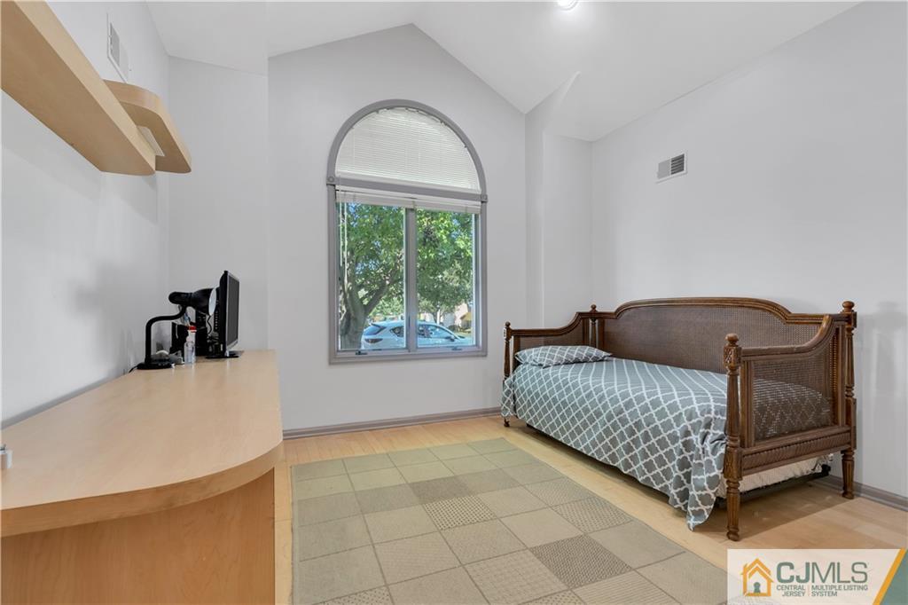 45 Harwood Road Monroe Township, NJ 08831 - Photo 29 of 35 a living room with a couch and a table