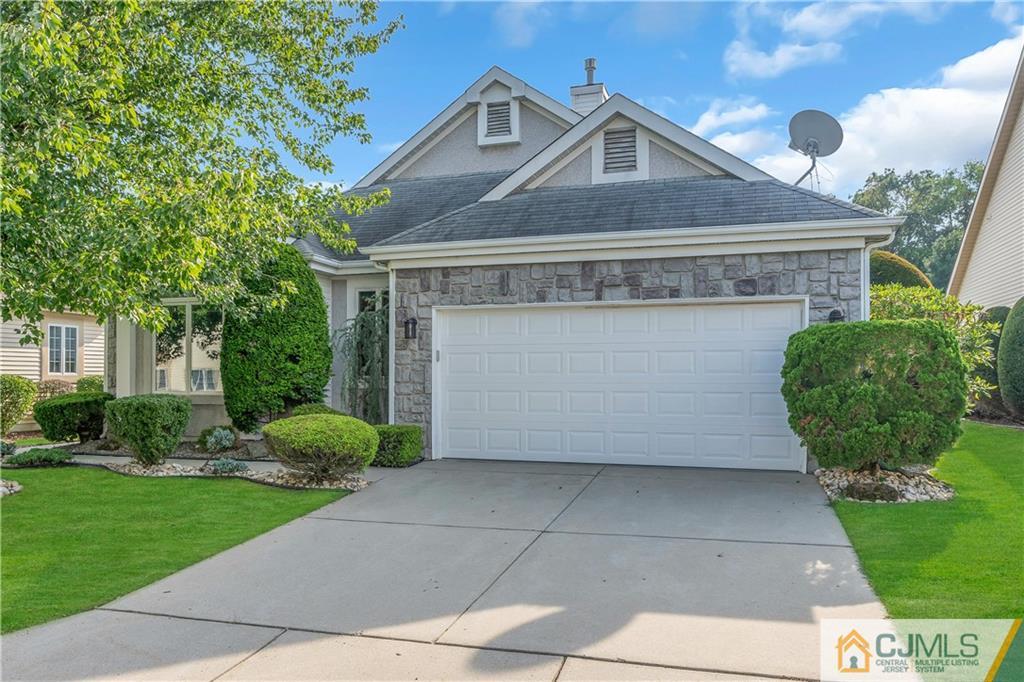 45 Harwood Road Monroe Township, NJ 08831 - Photo 3 of 35 a front view of a house with garden