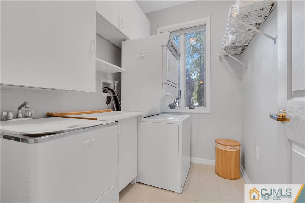 45 Harwood Road Monroe Township, NJ 08831 - Photo 31 of 35 a bathroom with a sink and a mirror