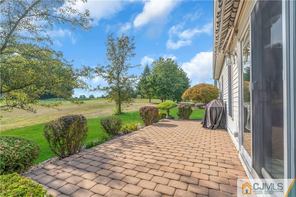 45 Harwood Road Monroe Township, NJ 08831 - Photo 32 of 35 a view of a patio with a yard
