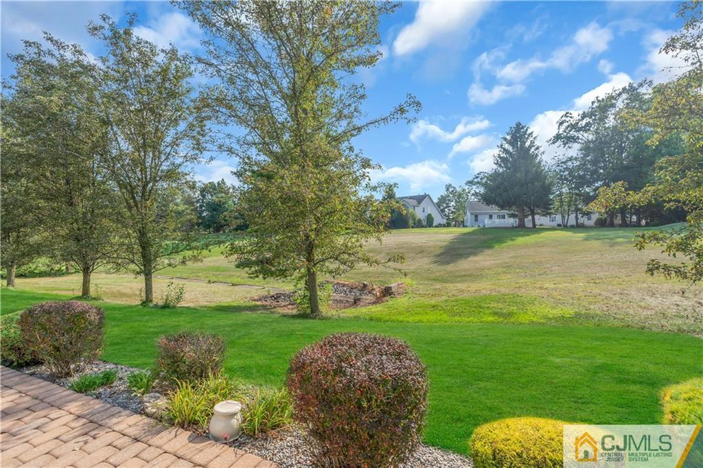 45 Harwood Road Monroe Township, NJ 08831 - Photo 33 of 35 a view of a golf course with a lake
